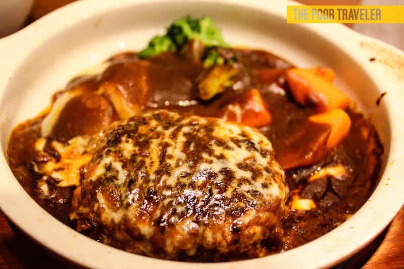Hamburg Steak. Not really a Japanese dish but it's pretty popular in Kansai region. Available in most restaurants and even convenience stores! 